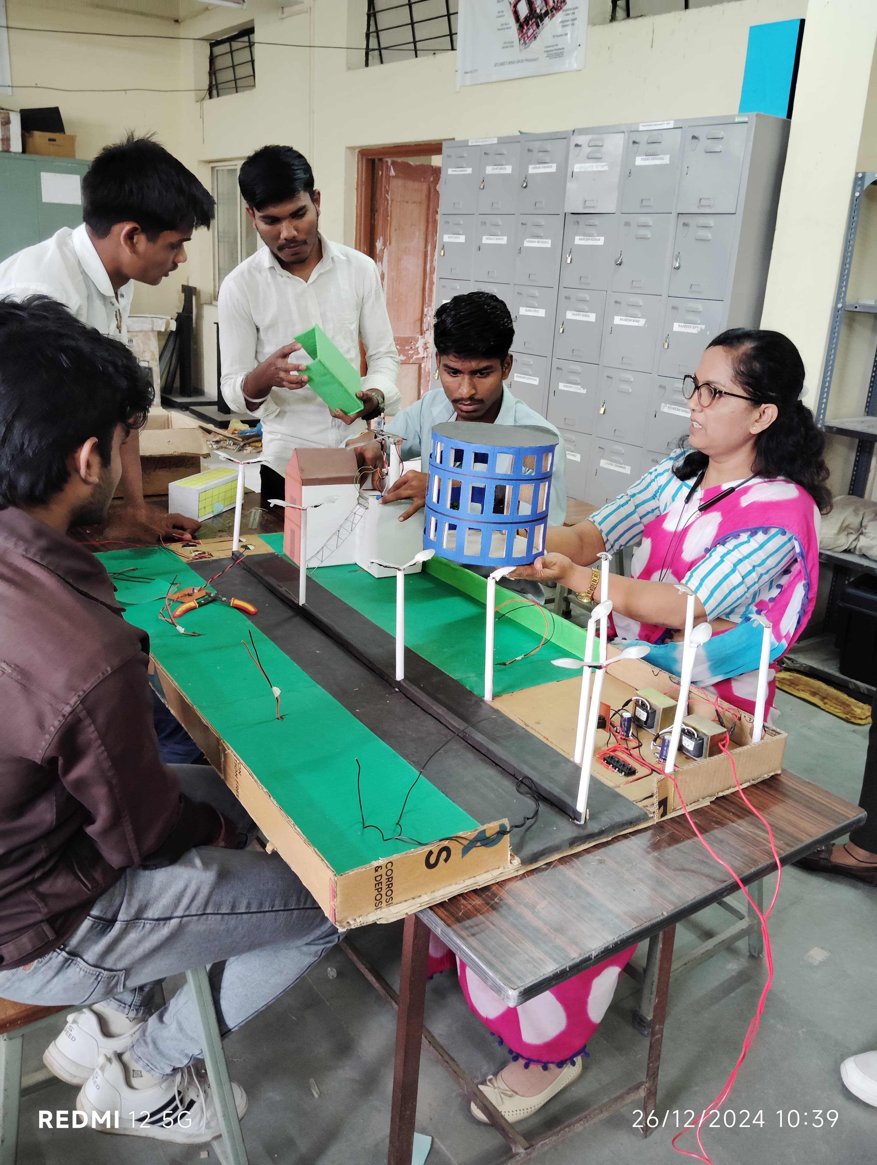 Trainees assembling a sensor-based project circuit